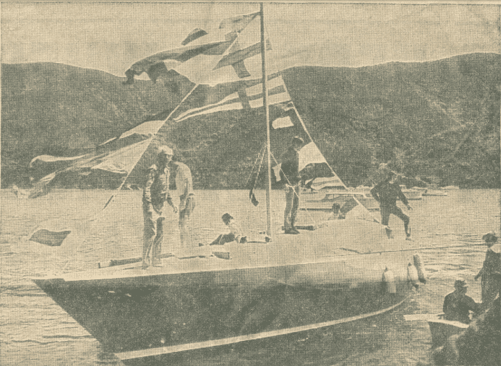 Black and white image of the yacht Koamaru with flags flying from its mast