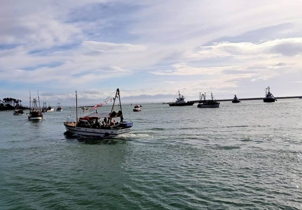 View of the Gleam in Nelson Harbour during the Blessing of the Fleet 2023. Other fishing boats are in the background.