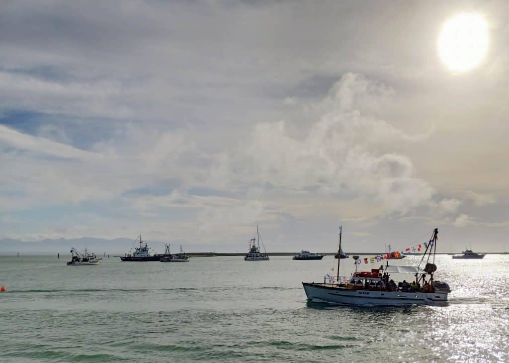 View of the Gleam in Nelson Harbour during the Blessing of the Fleet 2023. Other fishing boats are in the background.