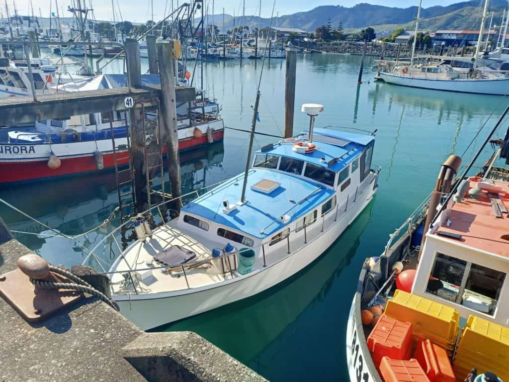 View of the boat Pescador in its berth in Nelson. The image is taken from above looking down on the boat.