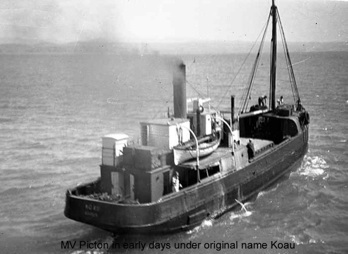 View from above of the boat Picton when she was named Koau. The image is taken from above looking down at the stern. Two people are working at the bow.