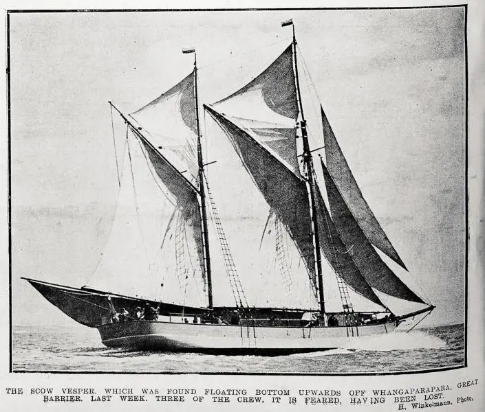 Black and white image of a newspaper image and text showing the scow Vesper under sail. The test reads "The scow Vesper which was found floating bottom upwards off Whangaparapara, Great Barrier last week, three of the crew, it is feared having been lost H. Winkelmann photo,"