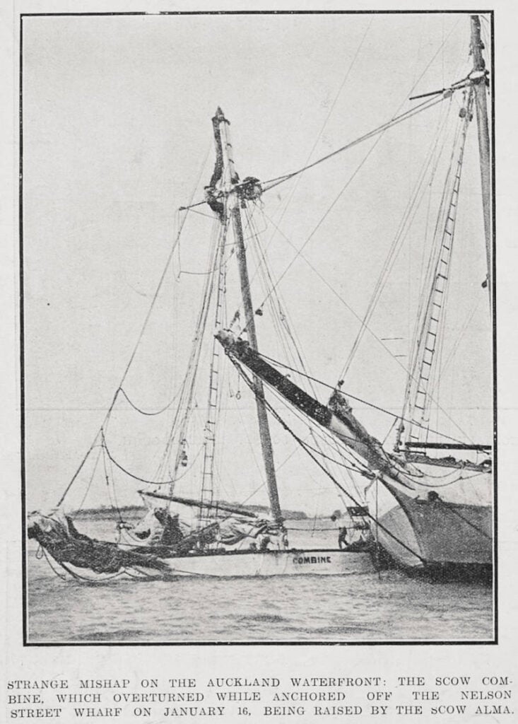 Black and white image of a the scow Combine being raised out of the water by the scow Alma.
